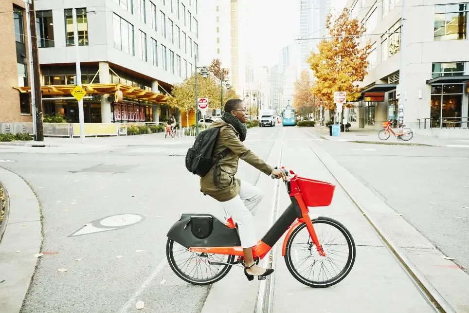 Person riding an E-Bike in a City 